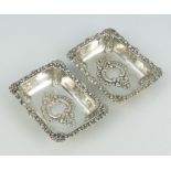 A pair of Continental 800 standard silver repousse rectangular dishes with scroll decoration 10.