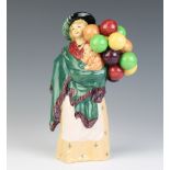 A Royal Doulton figure - The Balloon Seller HN 583 22cm