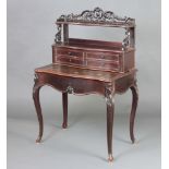 A 19th Century French rosewood writing table of serpentine outline, the upper section with pierced