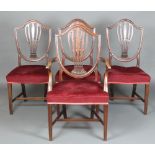A set of 4 19th Century Hepplewhite style shield back dining chairs with over stuffed seats,
