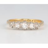 An 18ct yellow gold 5 stone diamond ring, size L 1/2