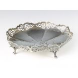 A silver octagonal dish with pierced rim on pad feet, Sheffield 1940 21cm, 292 grams