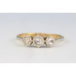 An 18ct yellow gold 3 stone diamond ring size M, 2 grams