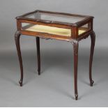 An Edwardian rectangular mahogany Chippendale style bijouterie table with hinged lid raised on