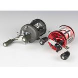 An Abu Ambassadeur 6500C multiplier fishing reel together with a left handed Okuma Nitryx x400 LX