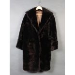 A lady's black beaver lamb full length coat