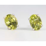 A pair of peridot and silver ear studs approx. 1.2ct