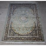 A green ground and floral pattern Kashan style Belgian cotton carpet with central medallion 280cm