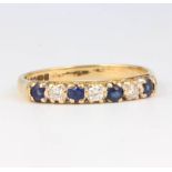 A 9ct yellow gold diamond and sapphire ring size O