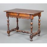 An 18th Century Continental walnut side table, the top formed of 4 planks fitted a drawer, raised on