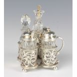 A Victorian silver 5 section cruet stand with pierced scroll decoration on ball feet, Sheffield