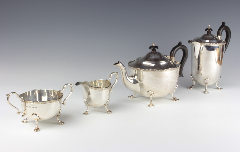 A silver 4 piece tea and coffee set with ebony mounts, Sheffield 1928/1929, gross 1558 grams