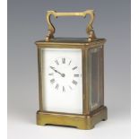 A 19th Century French 8 day carriage timepiece with enamelled dial and Roman numerals contained in a