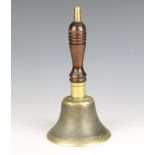 A 19th Century brass hand bell with turned wooden handle