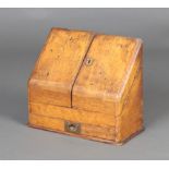 A Victorian light oak wedge shaped stationery box with stepped interior, the base fitted a drawer