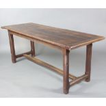 An oak rectangular refectory table raised on 4 chamfered supports with H framed stretcher 75cm h x