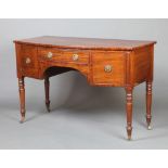 A Regency mahogany bow front sideboard fitted 1 long drawer flanked by a pair of cupboards