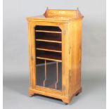 A Victorian inlaid rosewood music cabinet with raised back, fitted shelves enclosed by a glazed