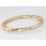 A 9ct 2 colour gold bangle approx. 9 grams gross