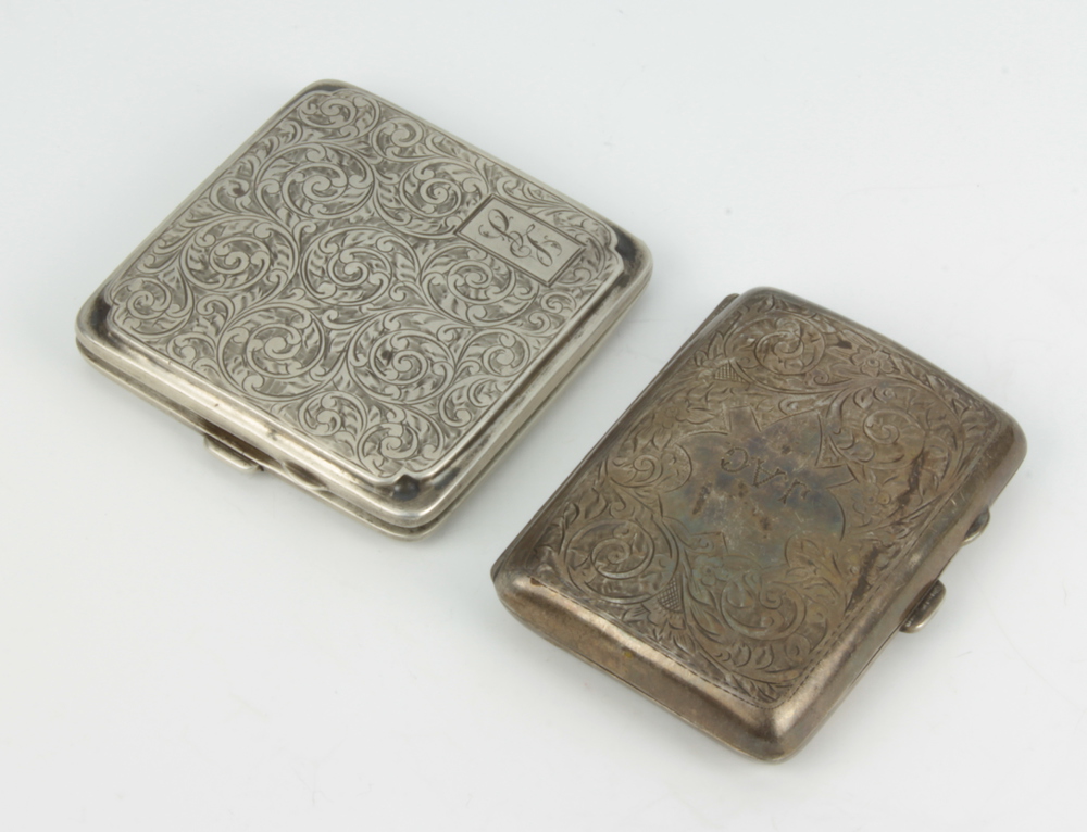 Two silver cigarette cases with scroll decoration Birmingham 1919 and Birmingham 1931, 159 grams