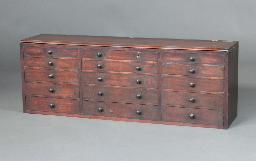 A Georgian mahogany table top chest with crossbanded hinged lid, fitted 3 compartments above 12