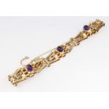 A 9ct yellow gold cabochon cut amethyst and pearl gate bracelet