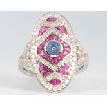 An 18ct white gold platinum, diamond, ruby and sapphire ring, size P