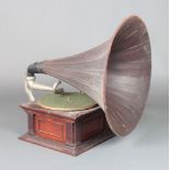 A HMV wooden horn "Junior Monarch" gramophone contained in a mahogany case with pressed wooden