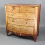 A 19th Century bleached mahogany bow front chest of 2 short and 3 long drawers with brass ring