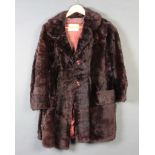 A lady's 2 button, three quarter length brown fur coat by Adukin of Brighton