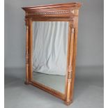 A 19th Century Continental rectangular bevelled plated over mantel mirror contained in a carved