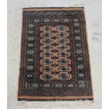 A tan ground Bokhara rug with 16 octagons to the centre within a multi row border 141cm x 92cm