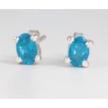 A pair of neon apatite silver ear studs approx 1.2ct