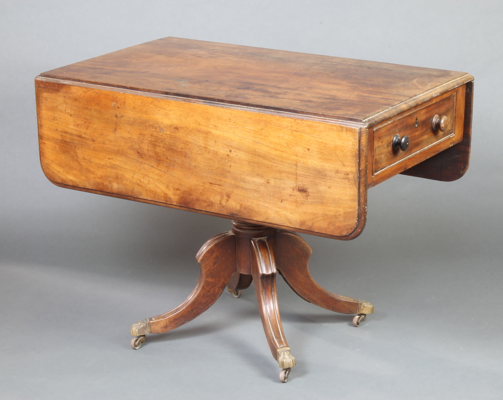 A George III mahogany pedestal Pembroke table fitted a drawer raised on pillar and tripod supports