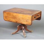 A George III mahogany pedestal Pembroke table fitted a drawer raised on pillar and tripod supports