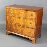 A 19th Century mahogany chest of 3 long drawers with brass ring drop handles, raised on bracket feet