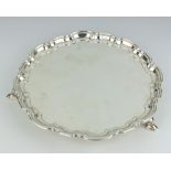 A silver salver with Chippendale rim on hoof feet Sheffield 1956, 25cm, 405 grams