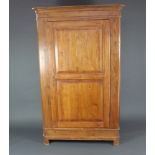 A 19th Century French pine "knockdown" wardrobe with moulded cornice enclosed by a panelled door