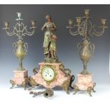 A 19th Century Art Nouveau French 3 piece spelter and marble clock garniture comprising striking
