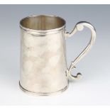 A Continental silver mug with scroll handle 12cm, 470 grams