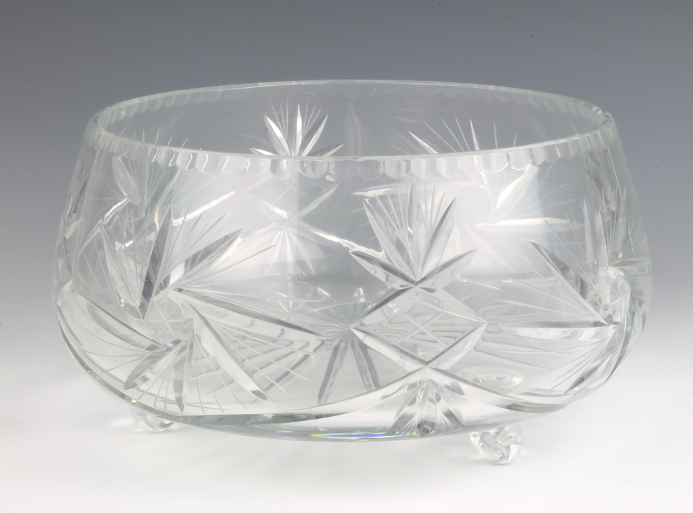 A cut glass fruit bowl raised on ball feet 30cm