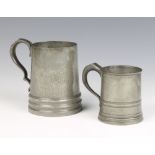 An Art Nouveau Tudric English pewter planished tankard, the base marked 6 Tudric English Pewter