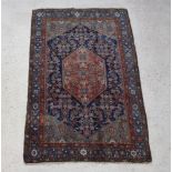 A brown and blue ground Malayer rug with diamond shaped central medallion within a multi row