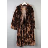 A lady's brown beaver lamb full length coat