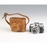 A 1950's HIT miniature camera with leather case