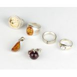 A silver and amber dress ring size M, 3 others and 2 pendants, 36 grams