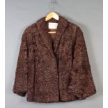 A lady's quarter length Persian lamb coat by William and Hutchins Ltd 8 Hanover Square Some wear