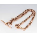A 9ct yellow gold curb link watch chain with T bar and clasp 39.9 grams