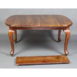 An oval mahogany extending dining table raised on cabriole supports with 1 extra leaf 73cm h x 104cm