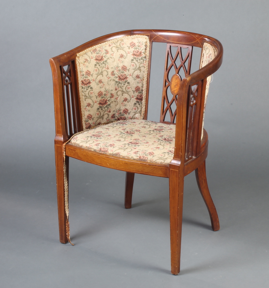 An Edwardian inlaid mahogany tub back chair with upholstered seat and back, raised on square tapered